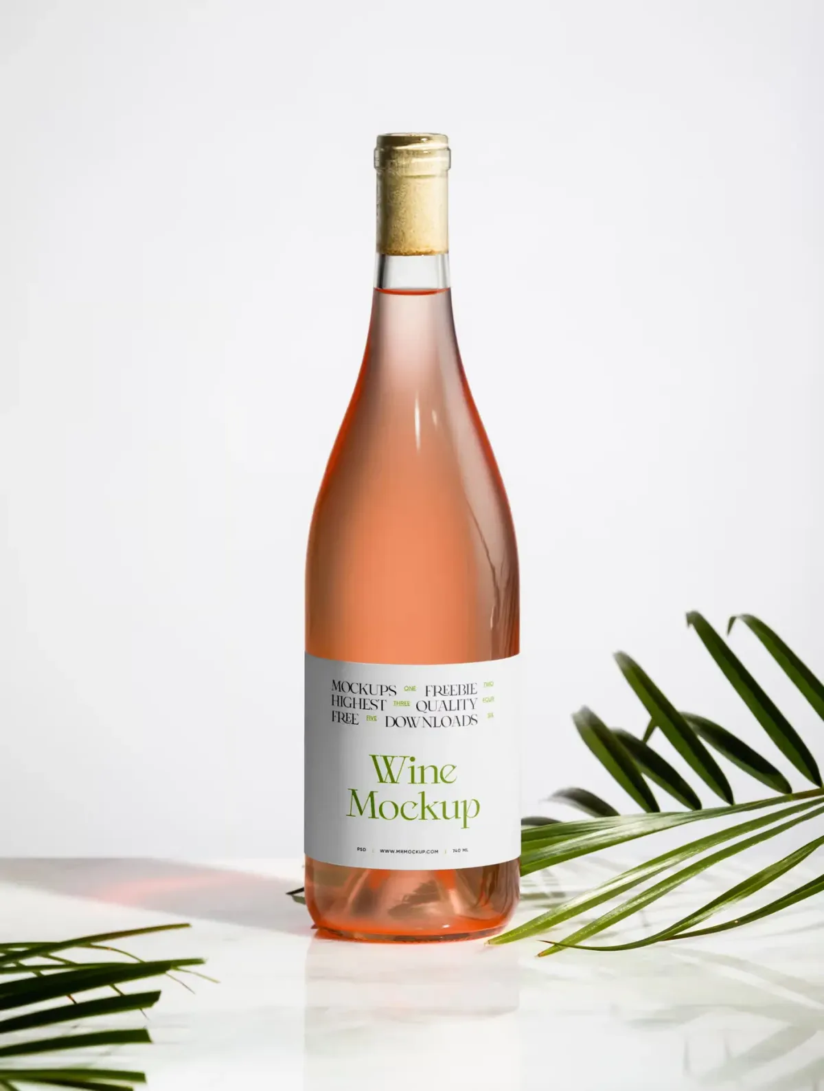 Rosé wine bottle with white Wine Mockup label, standing on a marble surface with palm leaves and warm light flare, plain background.